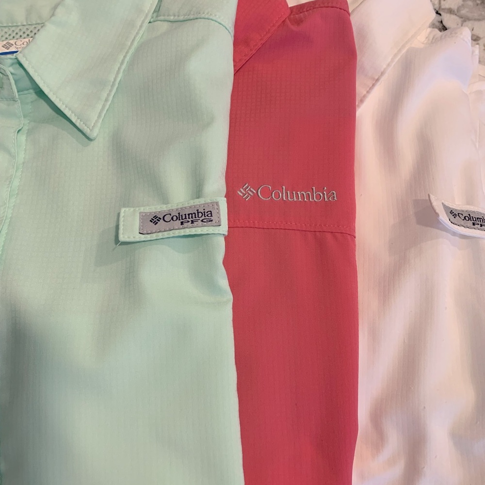 Three short sleeve Columbia sun protective shirts.